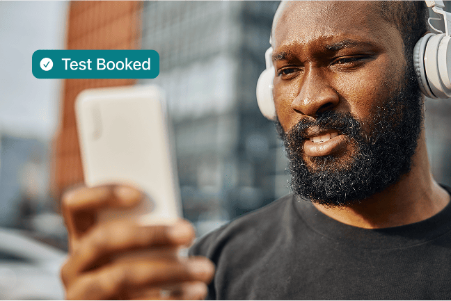 Person booking IV drip on phone